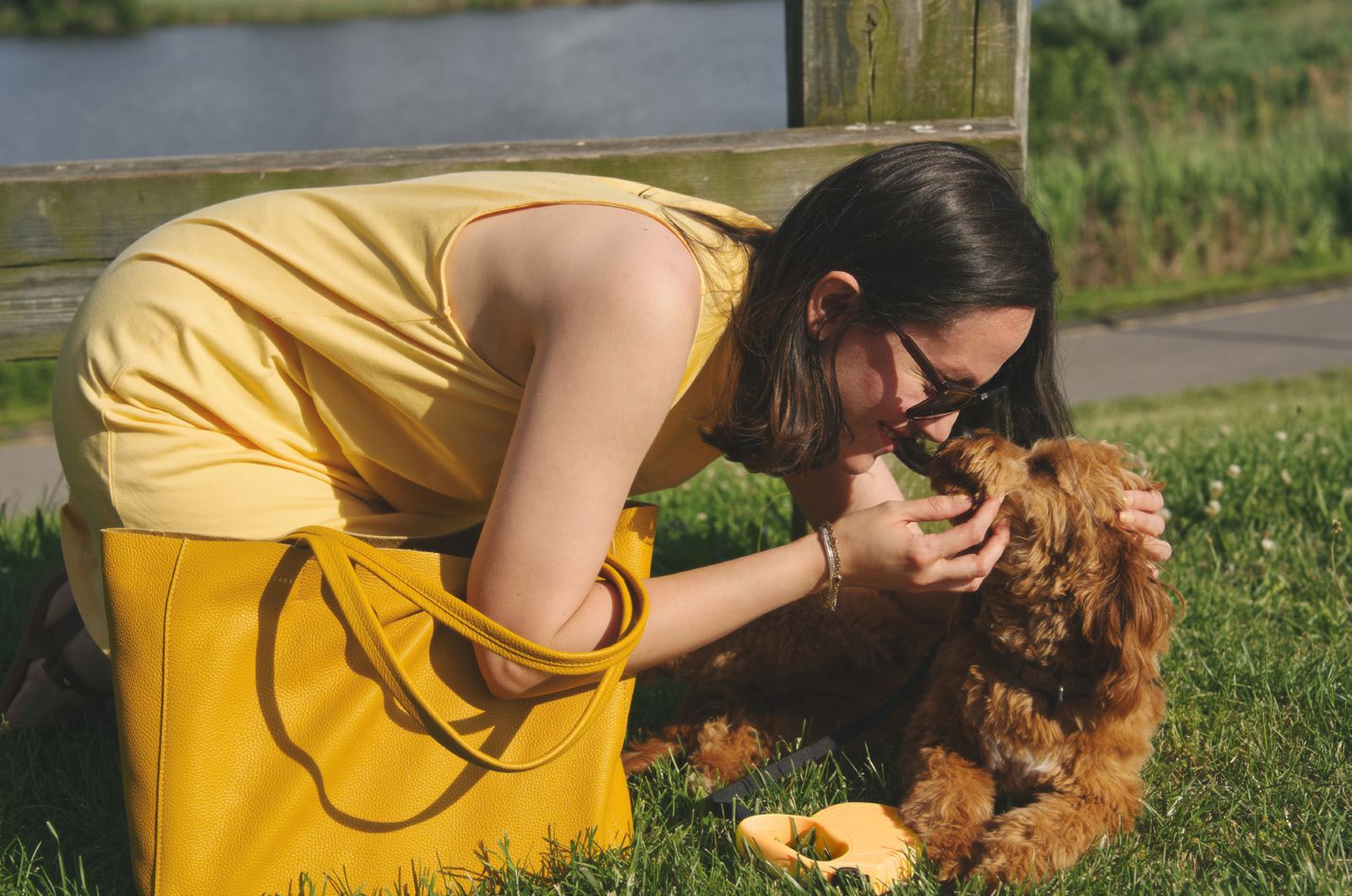 Kneeling in the grass with Penny, the Essex Tote at rest
