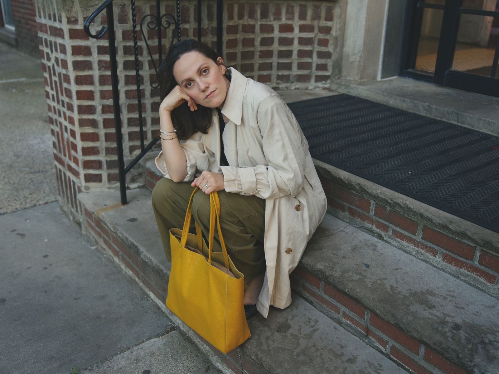 The Essex Tote in gold leather on brick steps